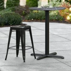 Deals 🔥 LT&S Alloy Series Lancaster Table & Seating Alloy Series Distressed Black Stackable Metal Indoor / Outdoor Industrial Cafe Counter Height Stool With Drain Hole Seat 🎉