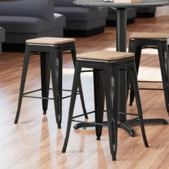Best Sale 🥰 LT&S Alloy Series Lancaster Table & Seating Alloy Series Distressed Black Metal Indoor Industrial Cafe Counter Height Stool With Natural Wood Seat ✨
