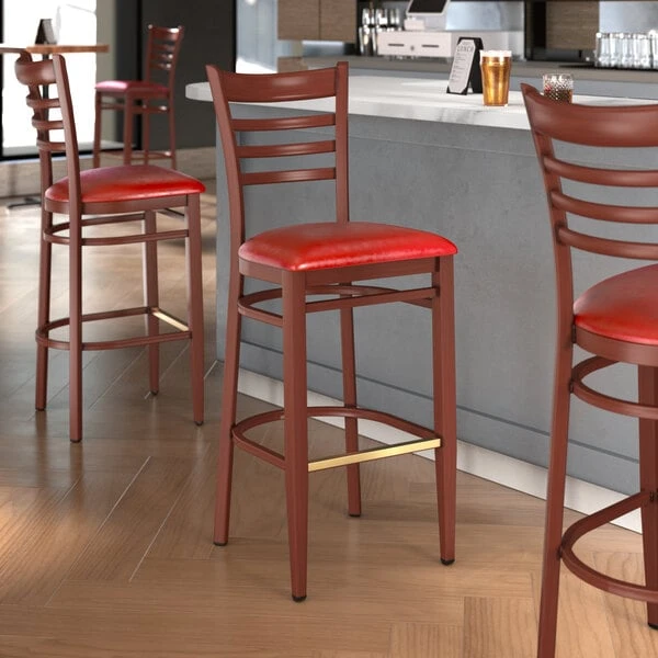 Deals 🌟 LT&S Spartan Series Lancaster Table & Seating Spartan Series Bar Height Metal Ladder Back Chair With Mahogany Wood Grain Finish And Red Vinyl Seat 😍