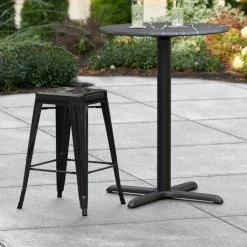 Outlet 👏 LT&S Alloy Series Lancaster Table & Seating Alloy Series Black Stackable Metal Indoor / Outdoor Industrial Cafe Counter Height Stool With Drain Hole Seat 🧨