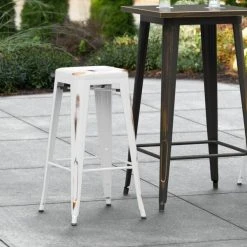 Brand new 😉 LT&S Alloy Series Lancaster Table & Seating Alloy Series Distressed White Stackable Metal Indoor / Outdoor Industrial Barstool With Drain Hole Seat 🛒