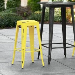 Deals 💯 LT&S Alloy Series Lancaster Table & Seating Alloy Series Distressed Yellow Stackable Metal Indoor / Outdoor Industrial Barstool With Drain Hole Seat ✔️