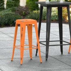 Hot Sale 💯 LT&S Alloy Series Lancaster Table & Seating Alloy Series Distressed Orange Stackable Metal Indoor / Outdoor Industrial Barstool With Drain Hole Seat ✨