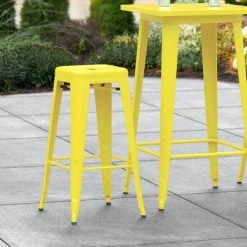 New 😍 LT&S Alloy Series Lancaster Table & Seating Alloy Series Yellow Stackable Metal Indoor / Outdoor Industrial Barstool With Drain Hole Seat 👍